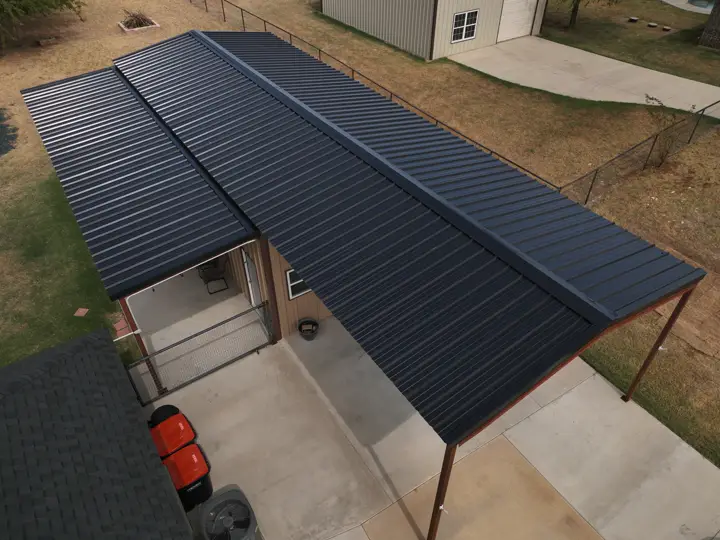 Black metal carport roof installed by TopCraft Roofing